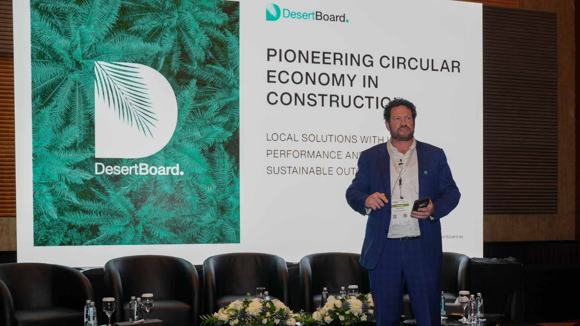 Speaker Holds a Presentation About Desertboard at the Conference