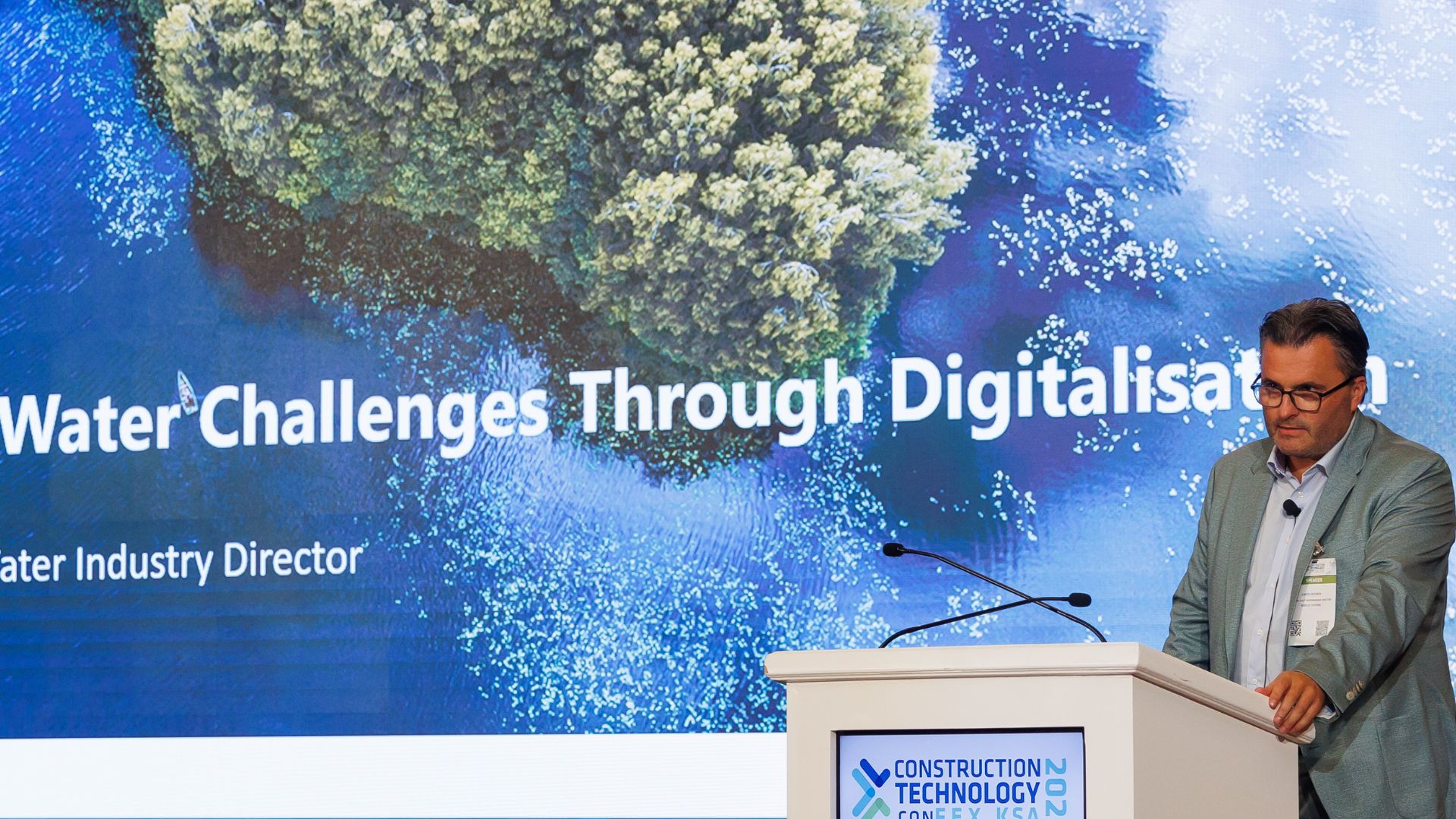 Speaker Presenting on Addressing Water Challenges Through Digitalisation