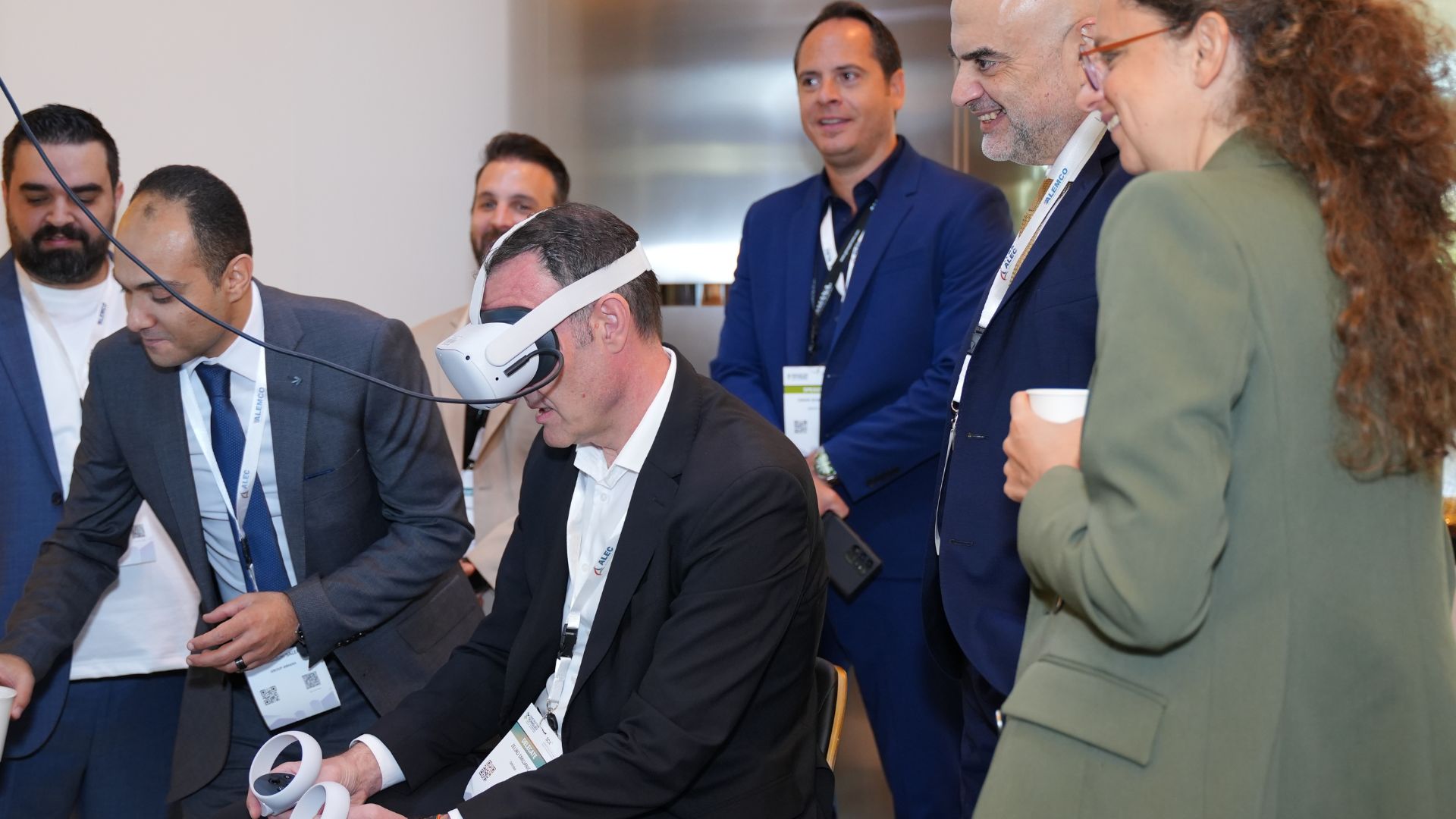 Attendees Networking and Discussing at an Exhibition Booth During CTF KSA