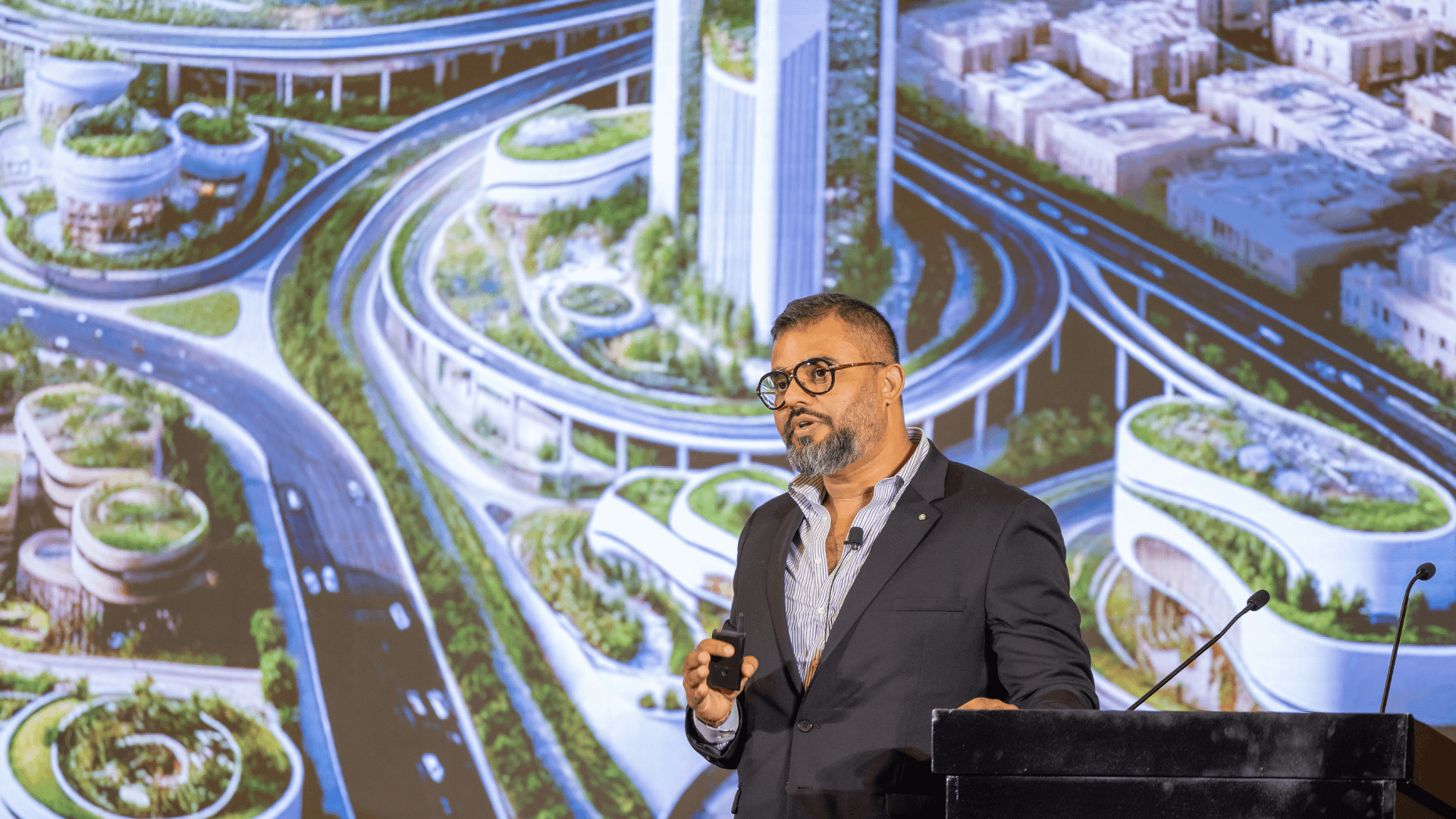 A Speaker Engaging with Audience on Transformation and Future-Building Initiatives